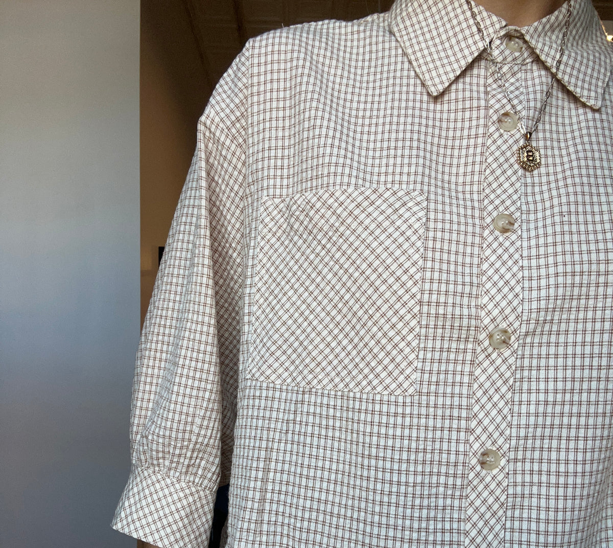 Mila Gingham Ruffle Hem Shirt-apparel-in february-The Funky Zebra Ames, Women's Fashion Boutique in Ames, Iowa